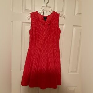 Perfect flare red dress with cutouts.  Like new and just the right flare.
